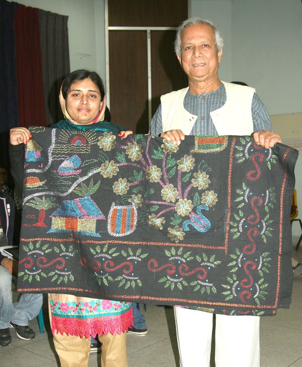Nobel Laureate Professor Yunus with Nobin Udyokta Lutfun Nahar, daughter of Grameen Bank borrower, whose Nakshi Kantha business was approved for financing at the 41st Social Business Design Lab